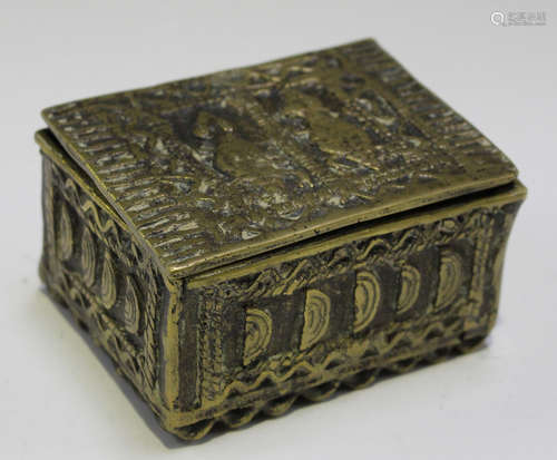 An African cast brass gold weight box of rectangular form, the removable lid decorated with two