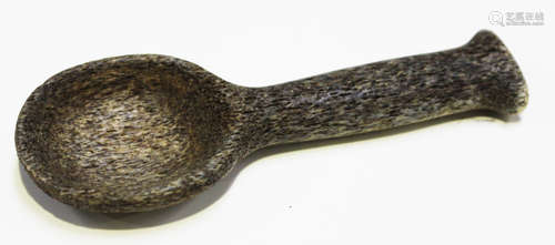 A late 19th/early 20th century antler spoon, possibly Maori, modelled with a rounded bowl and shaped