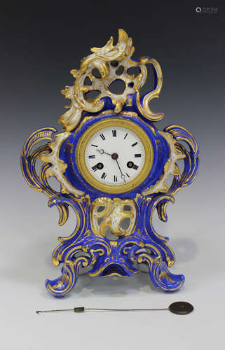 A Paris porcelain mantel clock, mid-19th century, the blue glazed body of rococo shape with gilded