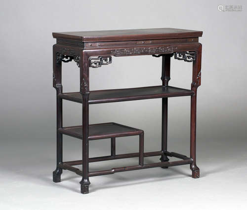 A Chinese hardwood display side table, early 20th century, the rectangular panelled top above a