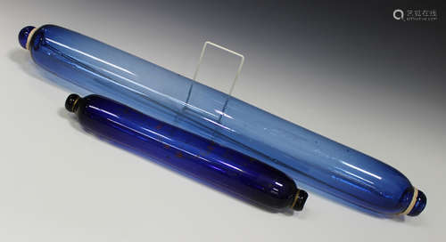 A large blue glass rolling pin, late 19th century, length 78cm, together with a smaller example,