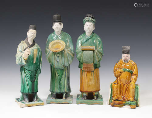 A group of four Chinese Ming style sancai glazed figures, modelled as three standing attendants