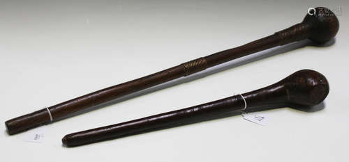 An African hardwood knobkerrie, the shaft with copper and brass wire bound collars, length 70cm,