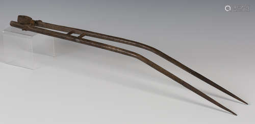 A Tibetan matchlock musket bipod stand, probably 19th century, formed as a pair of hardwood horns