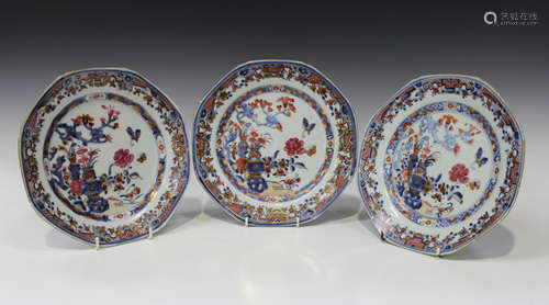 A set of three Chinese famille rose export porcelain octagonal plates, Qianlong period, each painted