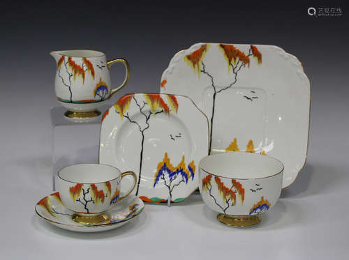 An Art Deco Carlton China part tea service, painted with a large and a small polychrome tree in