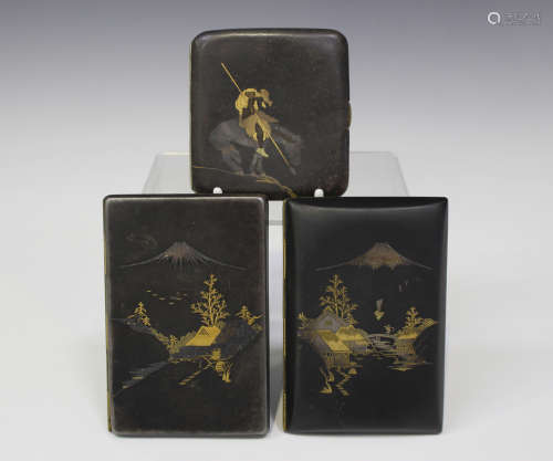 A group of three Japanese komai style damascened iron cigarette cases, 20th century, each of