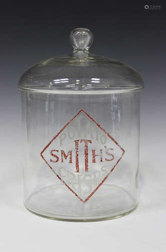 A Smith's Potato Crisps clear glass counter top advertising jar and cover, enamelled with a red