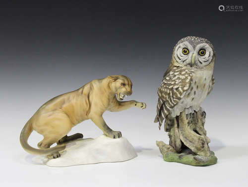 A Beswick matt glazed Puma, No. 1702, raised on a naturalistic base, height 21.5cm, together with