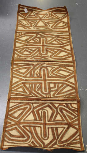 A mid-20th century Papua New Guinea tapa cloth, decorated with four geometric panels, 162cm x 59cm.