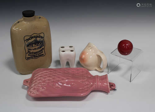 A Denby stoneware 'The Bungalow' footwarmer with screw top, a pink glazed wall pocket in the form of