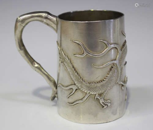 A Chinese silver tankard by Wang Hing, early 20th century, the tapered cylindrical body decorated in