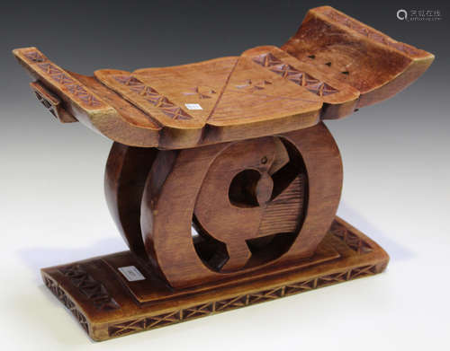 A mid-20th century carved and stained wooden Ashanti stool, width 44cm.Buyer’s Premium 29.4% (