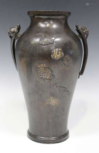 A Japanese brown patinated bronze vase, Meiji period, the baluster body decorated in low relief