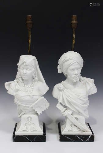 A pair of French bisque or Parian busts by Mauger et Fils, late 19th century, modelled as three-