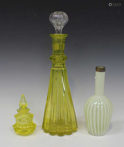 An Art Deco uranium glass decanter and stopper, 1920s/30s, of tapered lobed shape with faceted