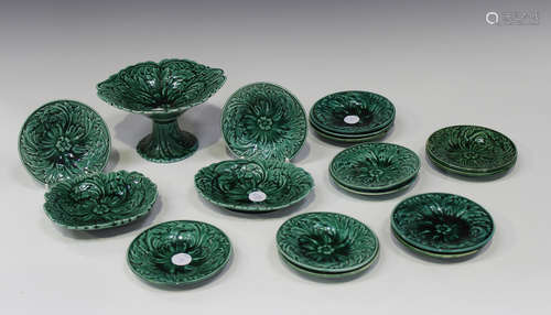 A harlequin set of diminutive green glazed nursery or children's leaf moulded wares, mid to late