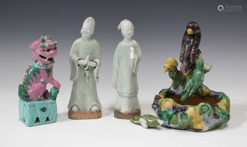 Two Chinese celadon and white glazed biscuit figures of attendants, Qianlong period, modelled