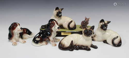 A collection of decorative ceramic animals, including two Sylvac Bassett Hounds, seven Beswick cats,