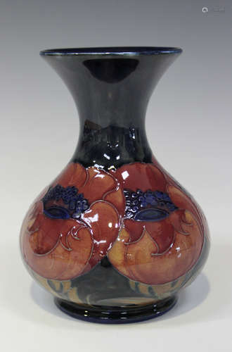 A Moorcroft pottery Big Poppy pattern vase, circa 1920, the bulbous body with everted neck and