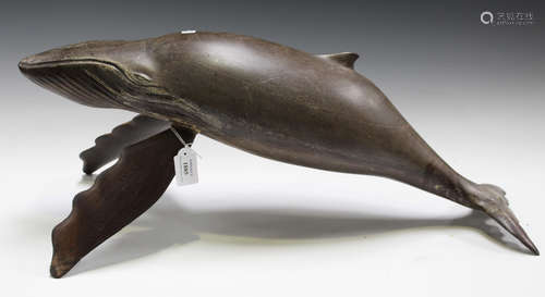 An early 20th century painted and carved wooden model of a humpback whale, length 74cm (some