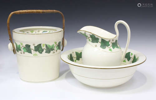 A Wedgwood creamware part wash set, circa 1895, decorated with bands of green enamelled ivy,