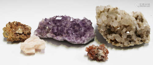 A group of five mineral specimens, including amethyst, a quartz cluster and a pyrite section.Buyer’s