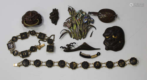 A small collection of Japanese metalwork, Meiji period and later, including a Mount Fuji and wave