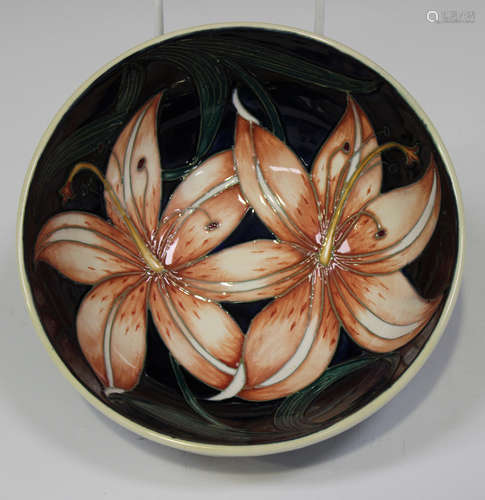 A Moorcroft pottery Pink Damask pattern footed bowl, circa 2004, designed by Philip Gibson, printed,