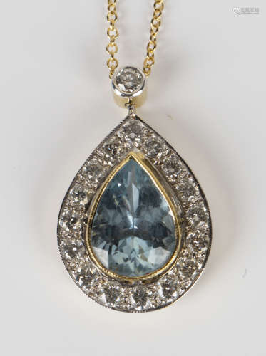 A gold, aquamarine and diamond pendant, mounted with a pear shaped aquamarine within a surround of