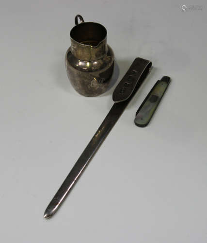 An Edwardian silver paperknife and ruler, the front with measurements to eight inches, Birmingham
