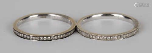 An 18ct white gold and diamond eternity ring, mounted with circular cut diamonds, ring size approx