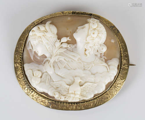 A Victorian gold mounted oval shell cameo brooch, carved as two classical portraits of maidens