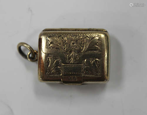 A George IV silver gilt rectangular vinaigrette, the hinged lid engraved in the form of a purse with