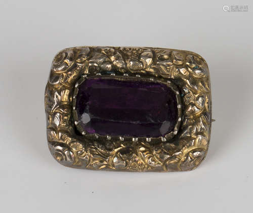 A Georgian mauve paste set rectangular brooch, decorated with a floral border, circa 1800, width 1.