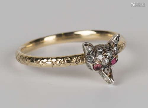 A 15ct gold ring with engraved decoration, the front applied with a rose cut diamond set fox's