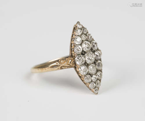 A gold and diamond marquise shaped cluster ring, mounted with cushion shaped diamonds with the