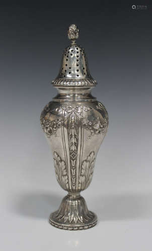 A Continental silver sugar caster with pierced dome cover and foliate finial, the baluster body