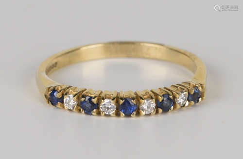 An 18ct gold, sapphire and diamond half-hoop ring, claw set with five circular cut sapphires