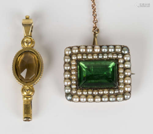A gold, seed pearl and foil backed green gem set rectangular brooch, fitted with a safety chain,