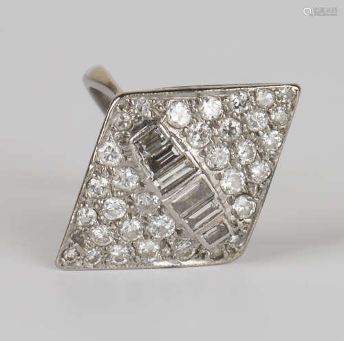 A white gold and diamond lozenge shaped cluster ring, the centre with a row of six graduated