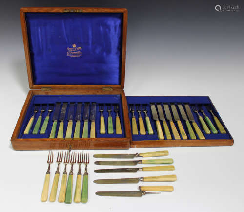 A collection of George III and Victorian silver gilt dessert knives and forks with green stained