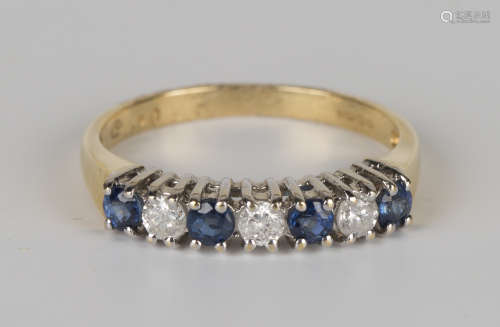 An 18ct gold, sapphire and diamond half-hoop ring, claw set with four circular cut sapphires