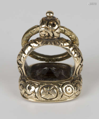 A Victorian smoky quartz pendant fob seal, the mount with floral decoration, the smoky quartz