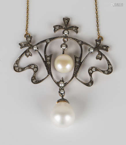 A gold, silver, cultured pearl and diamond necklace in a scrolling design, cased.Buyer’s Premium