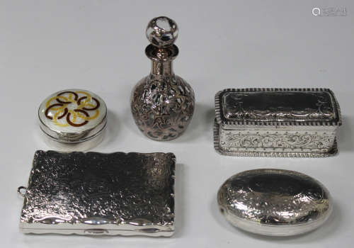 A late Victorian silver rectangular purse with scroll engraved decoration and burgundy leather and