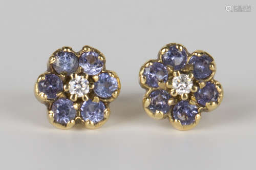 A pair of 18ct gold, tanzanite and diamond earstuds, each in a flowerhead design, with post and