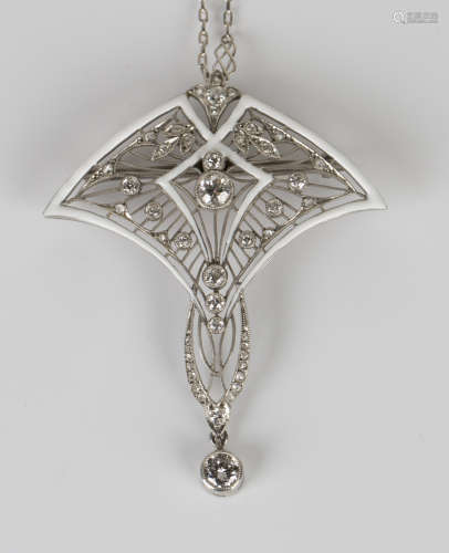 A white gold, diamond and white enamelled pendant brooch in a stylized fan shaped filigree and