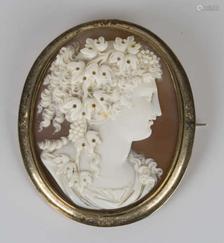 A 19th century gilt metal mounted shell cameo brooch, carved as a profile bust portrait of a