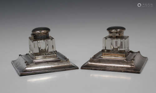 A pair of Edwardian silver mounted inkstands, each cut glass inkwell with silver collar and hinged